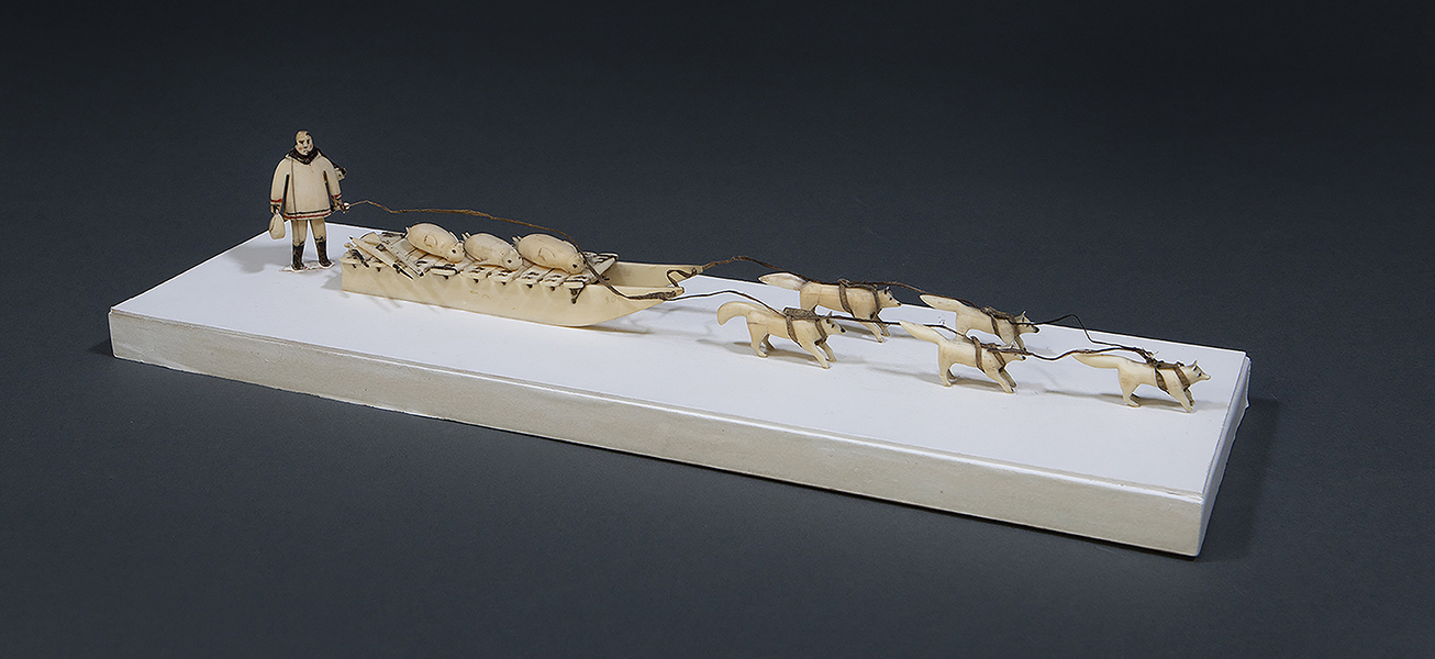 CARVED ESKIMO DOG TEAM, SLED, SEALS, AND MAN, LATE 19TH - EARLY 20TH CENTURY
